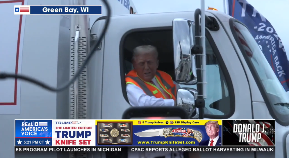 Trump rifing a garbage truck in Green Bay